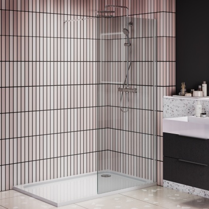 product lifestyle image of 1400mm x 800 single panel walk in shower enclosure and tray in white bathroom vertical brick tiles